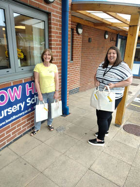 Helen and Natalie, with Play at Home packs outside nursery school